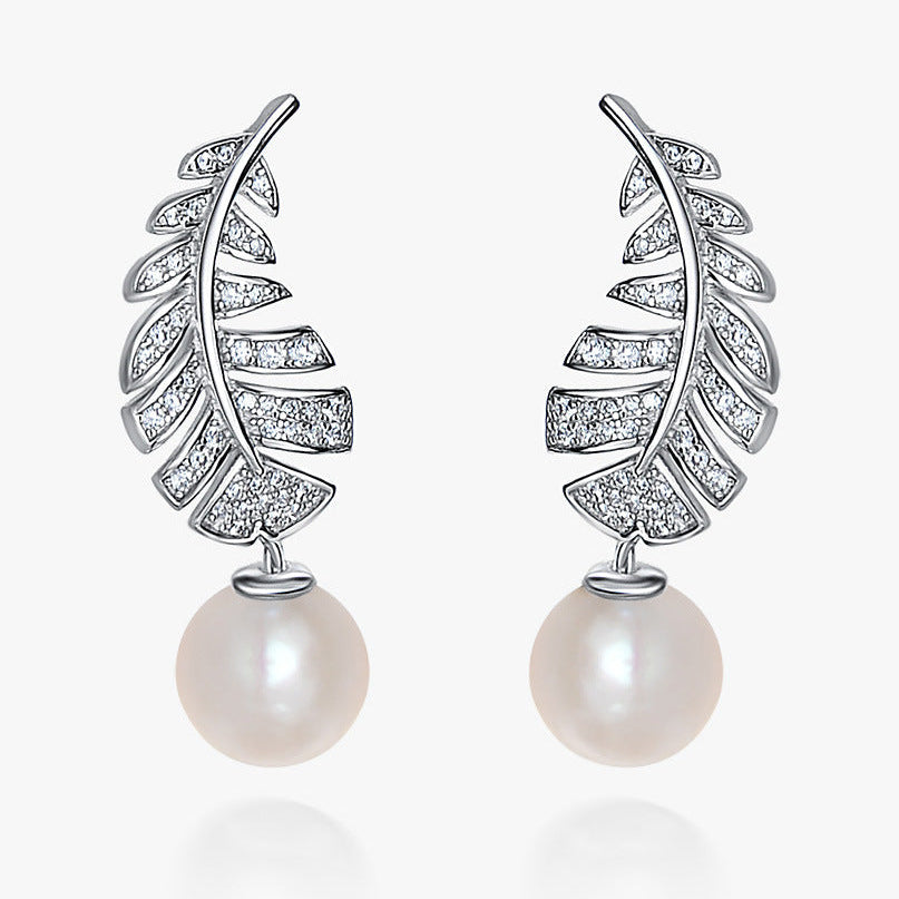 Leaf-shaped earrings with pearl drops on a white background, featuring the SHIPEI JEWELRY brand.