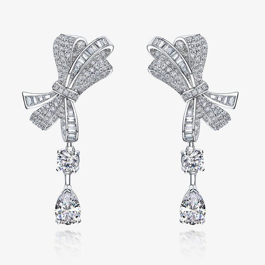 Bow-shaped earrings with teardrop designs on a white background, featuring the Shipei Jewelry brand.