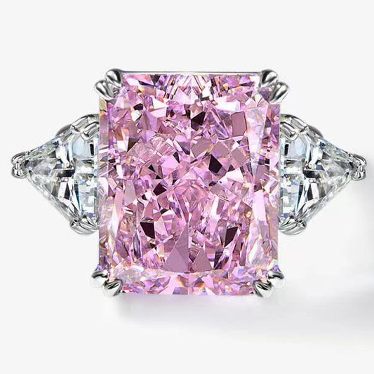 Pink diamond ring with silver prongs on a white background, featuring the Shipei Jewelry logo.