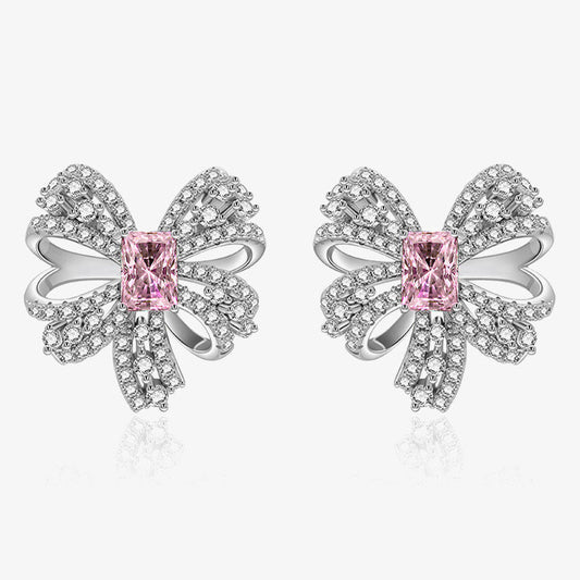 Butterfly-shaped earrings with pink gemstones on a white background, featuring the SHIPEI JEWELRY brand.