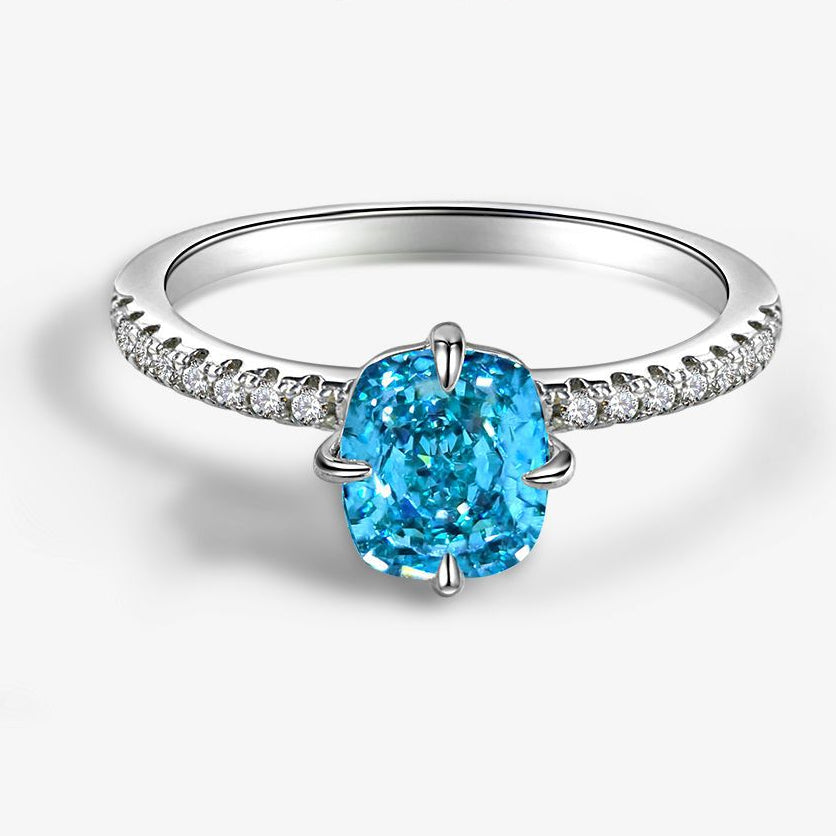 Silver ring with a blue gemstone and diamond accents on a white background, featuring the Shipei Jewelry logo.