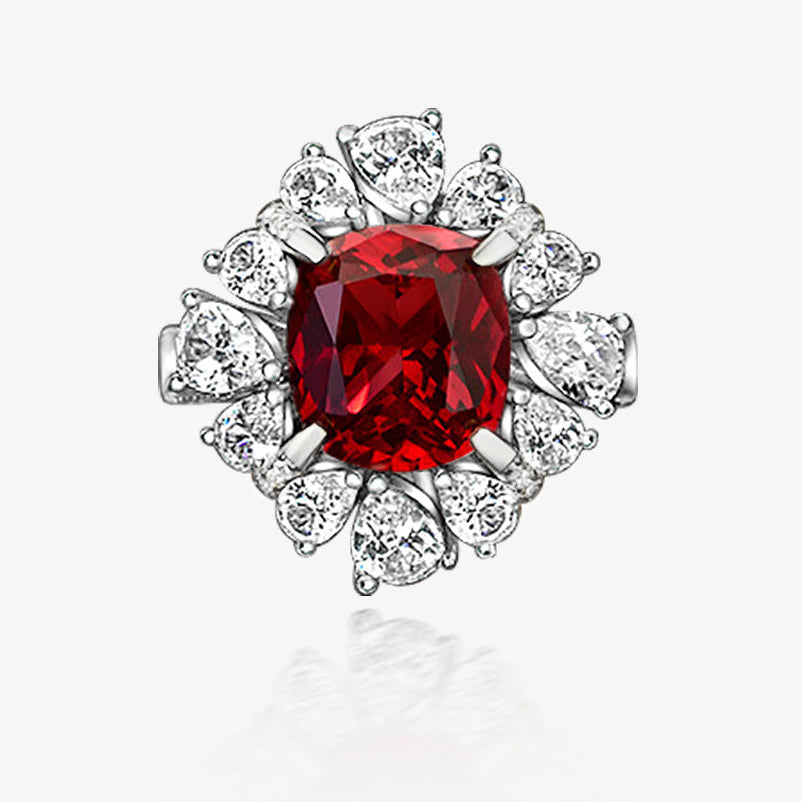 Silver ring with a red gemstone and diamonds on a white background, featuring the Shipei Jewelry logo.