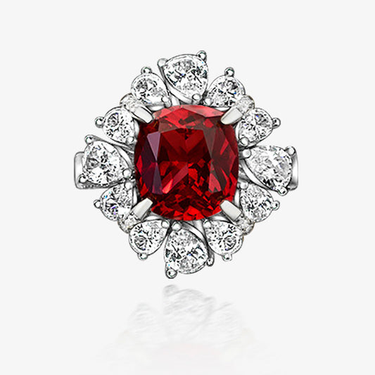 Silver ring with a red gemstone and diamonds on a white background, featuring the Shipei Jewelry logo.