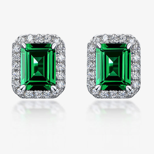 Pair of emerald green gemstone earrings with silver frames on a white background, featuring the SHIPEI JEWELRY brand.