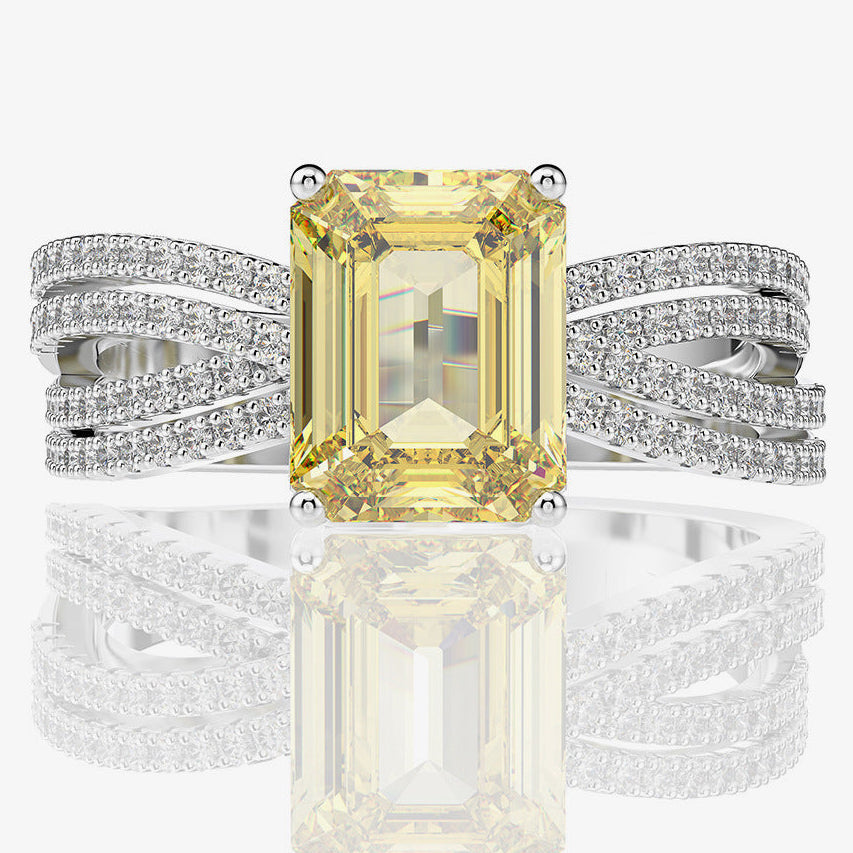 Ring with yellow gemstone and silver band on a white background, featuring Shipei Jewelry logo.