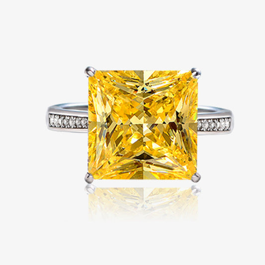 Yellow diamond ring with silver setting on a white background, featuring the Shipei Jewelry logo.