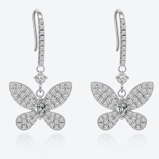 Butterfly-shaped earrings with sparkling stones on a white background, featuring the Shipe Jewelry logo.