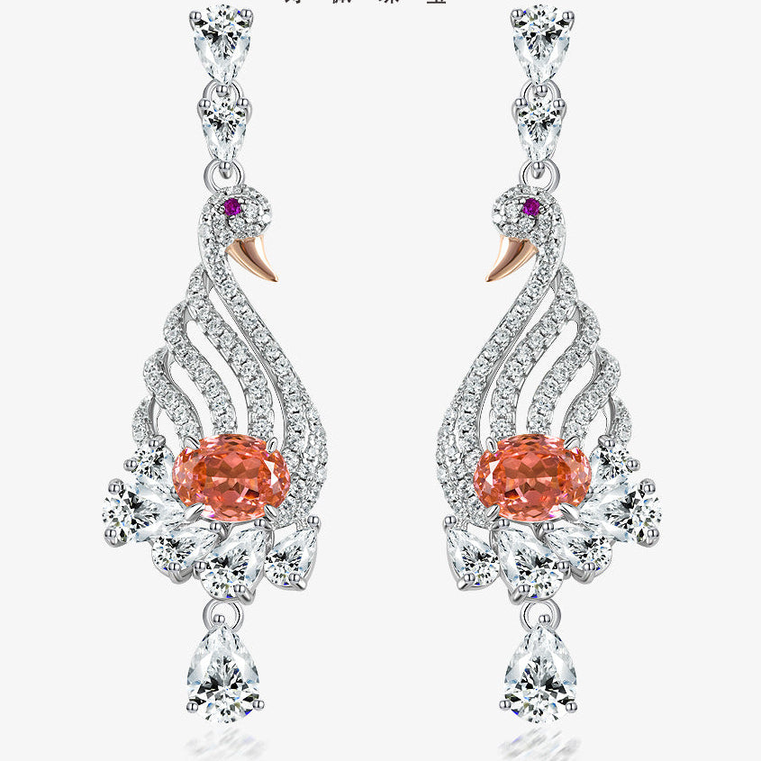 Elegant earrings with orange gemstones and silver detailing on a white background, featuring the Shipei Jewelry brand.