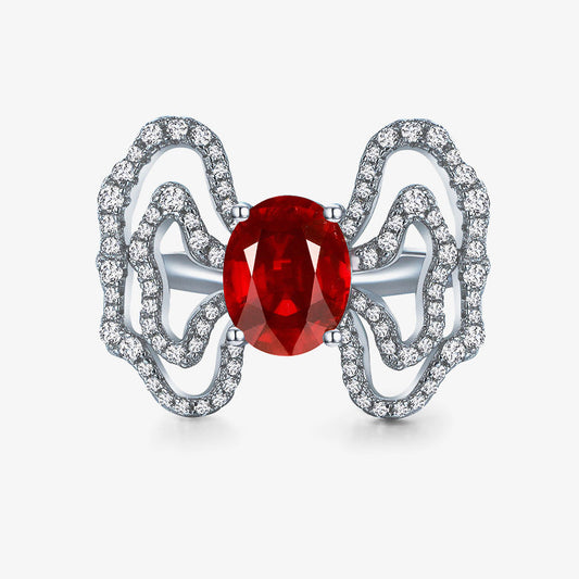 Butterfly-shaped jewelry with a red gemstone on a white background, featuring the SHIPEI JEWELRY brand.