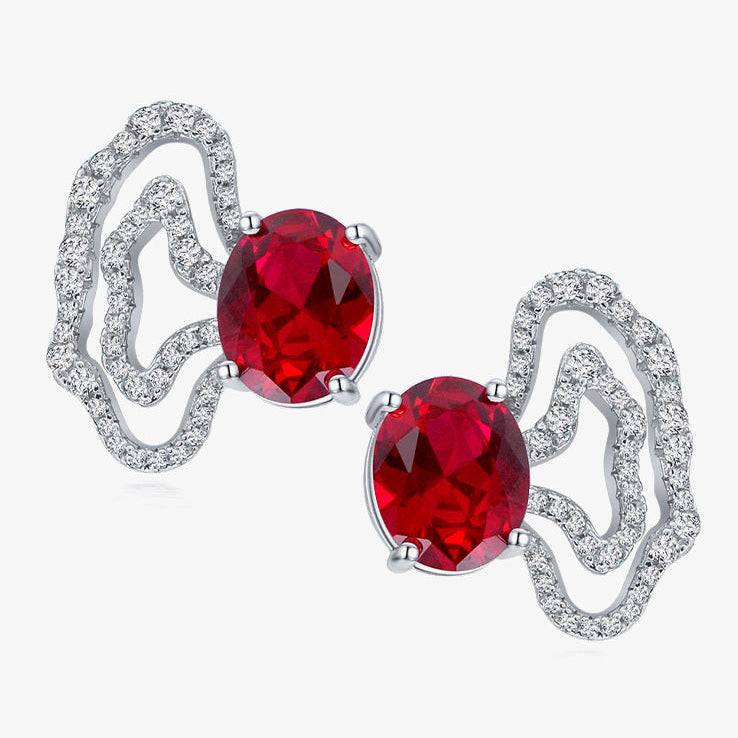 Red gemstone earrings with silver setting on a white background, featuring the Shipei Jewelry logo.